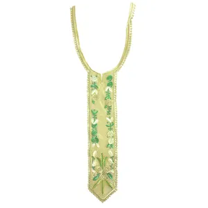 Detail view of floral embroidered lace collar with golden thread and green accents
