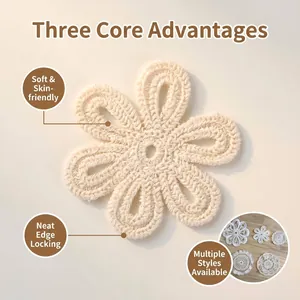Close-up of a handmade cream crochet lace flower coaster with intricate hollow design