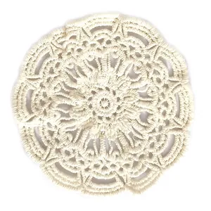 Vintage white cotton crochet lace coaster with intricate floral pattern embroidery