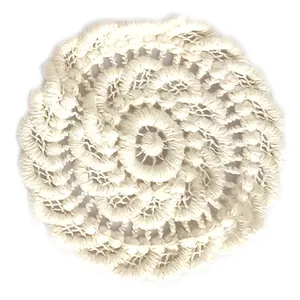 Macro view of white crochet lace flower coaster with intricate hollow floral pattern
