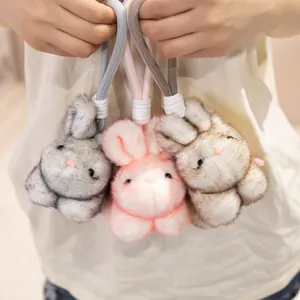 Set van drie schattige pluizige konijnen pluche hangers in grijs roze en beige kleur