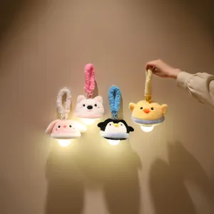 Multiple cute animal plush night lights glowing on a wall as decorative pendants