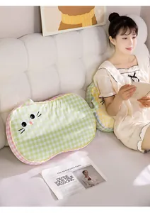 Comfortable cat-shaped memory foam pillow used as a backrest cushion in a bedroom setting