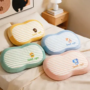 Set of four colorful memory foam pillows with cute cartoon animals on a cozy bed.