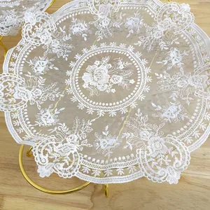 Close-up of elegant vintage white floral lace placemat with mesh embroidery details