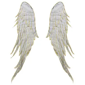 Detailed view of elegant gold embroidered angel wing patches on translucent grey organza fabric