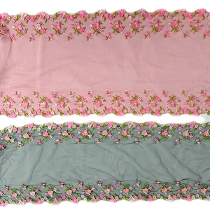 Close-up of heavy floral embroidery lace trim in pink and grey colors for DIY sewing accessories