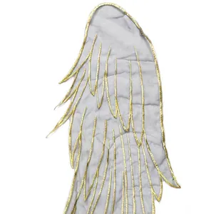 Close-up detail of golden embroidered organza wing patch for DIY fashion clothing accessories