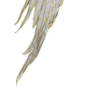 Close-up of gold metallic embroidery on grey organza wing-shaped lace fashion trim