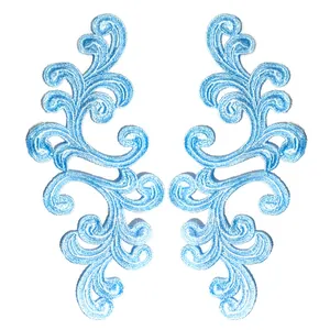Close-up detail showing the intricate texture of symmetrical light blue floral lace patches
