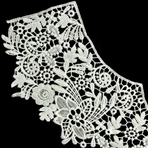 Detailed close-up of white milk silk embroidered lace collar with hollow floral patterns