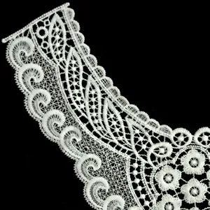 Detailed close-up of white milk silk embroidered lace collar with hollow pattern