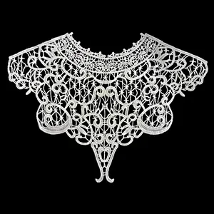 Detailed macro view of white milk silk embroidered lace faux collar with floral hollow-out