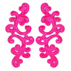 Macro detail of symmetrical hot pink water-soluble embroidered floral lace patches