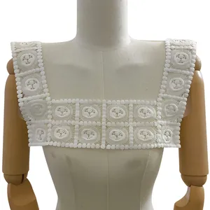 Detailed view of the white milk silk embroidered lace fake collar on a mannequin bust