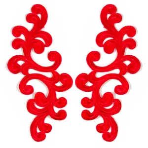 Detailed macro view of red symmetrical water-soluble embroidered lace floral appliques