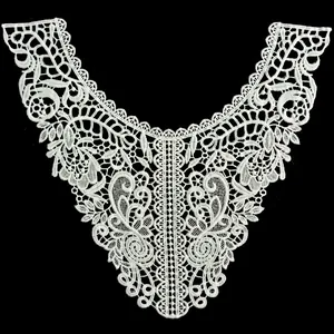 Detailed view of intricate white water-soluble lace embroidery on milk silk collar