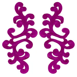 Close-up view of symmetric magenta water-soluble embroidery lace patches for DIY crafts