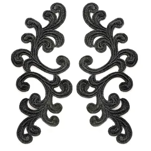 Detailed macro shot of symmetrical black water-soluble lace embroidered patches for DIY