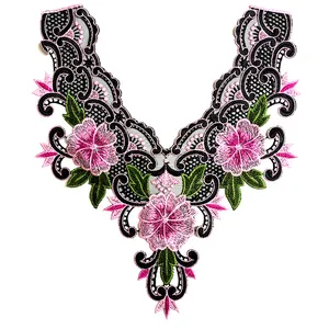 Detail view of floral embroidery lace neckline patch with pink flowers and green leaves