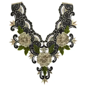 Detail view of black mesh embroidery lace collar with gold flowers and green leaves