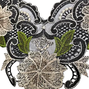 High-quality close-up of intricate embroidered lace collar with floral and bee motifs.