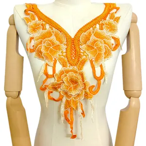 Détail de la broderie sur col en dentelle florale orange avec applique 3D de qualité