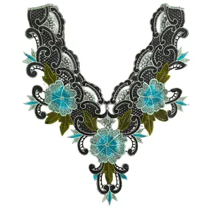 Close-up of colorful floral embroidered lace collar with blue flowers and green leaves