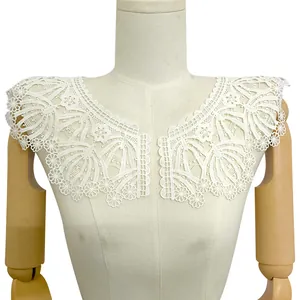 Close-up detail of white milk silk embroidered lace collar with hollow floral patterns