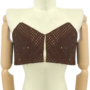 Detailed view of brown water-soluble lace embroidery bra piece with hollow pattern.