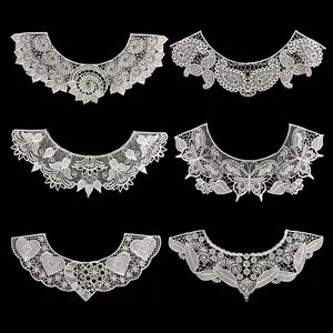 Detailed macro view of six hollowed-out white embroidered lace detachable collars
