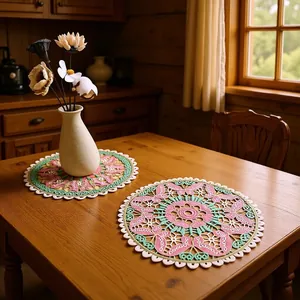 Close-up of colorful butterfly embroidered lace doily on a rustic wooden table.