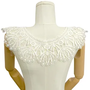 Close-up detail of white milk silk embroidered lace faux collar on mannequin back