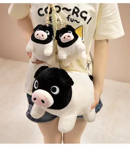 Model wearing a cute black-faced pig plush crossbody bag with two matching charms