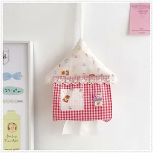 Detailed view of the cute red house-shaped gingham fabric hanging tissue box holder