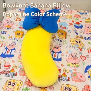 Coussin en peluche en forme de banane avec gros nœud bleu pour dormir