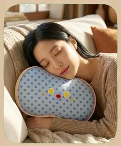 Asian woman sleeping on a cute blue polka dot cat memory foam nap pillow on a cozy sofa