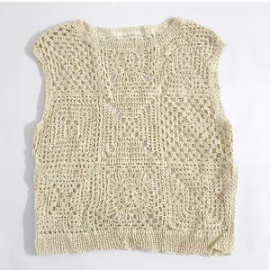 Close-up detail showcasing the intricate floral crochet textures of this cream vest