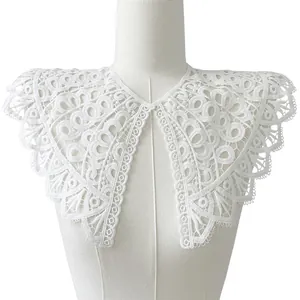 Detailed view of elegant white embroidered lace detachable collar accessory on mannequin