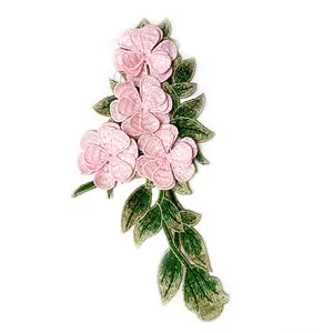 Close-up of 3D embroidered floral lace patch with pink flowers and green leaves
