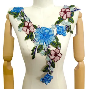 Detailed close-up of colorful floral embroidered lace false collar with ethnic pattern