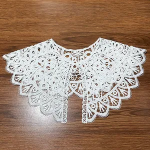 Close-up detail of white milk silk embroidered hollow lace doll collar false neckpiece
