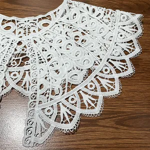 Detailed view of white milk silk embroidered lace fake collar with hollow floral design