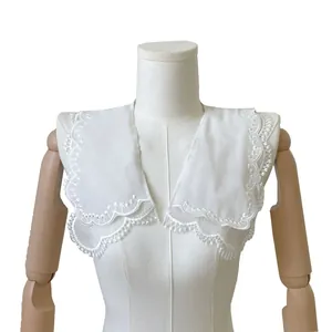 Detailed view of elegant white double-layer lace doll collar with fine embroidery