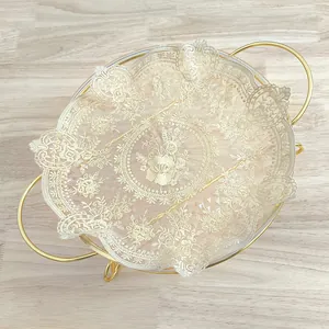 Detail view of vintage beige embroidered lace placemat with floral mesh patterns