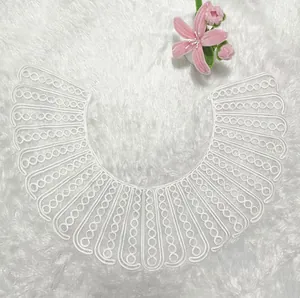 Detail view of the intricate rope embroidery on this white lace detachable doll collar