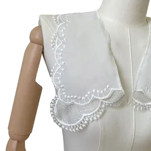 Detailed view of white double-layer lace detachable collar with floral embroidery