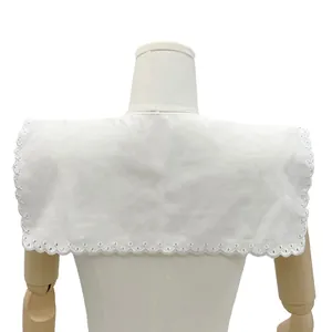Detailed back view of a white perforated lace embroidered baby collar on a mannequin