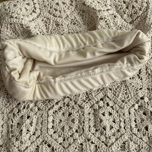 Detailed view of elasticated inner lining and precise stitching on crochet dress