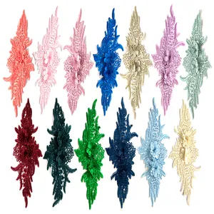 Detailed macro view of 3D lace embroidery flower patches in various vibrant colors